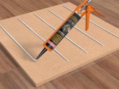 Applying EVO-STIK Seriously Strong Stuff Ultimate Adhesive in parallel beads onto a panel for secure installation and bonding