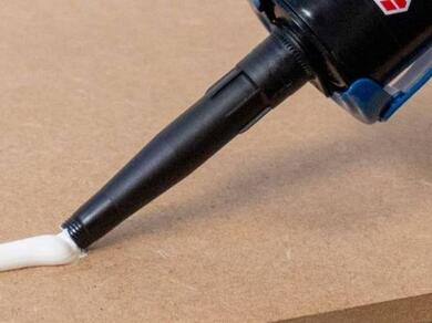 Applying grab adhesive from a cartridge onto a panel surface for strong installation and bonding without mechanical fixings