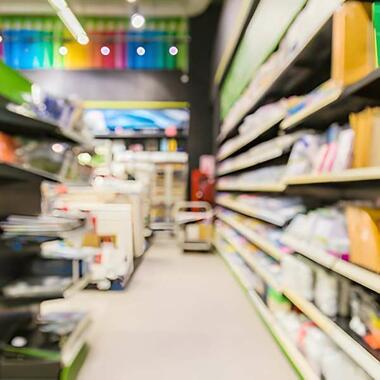 Retail store aisle with shelves displaying DIY, craft and home improvement products